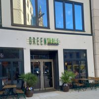 Rathaus reflected in window at Greentable in Hamburg