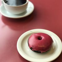 Raspberry Donut + Coffee. Breakfast of Champs! at Beet Box Bakery & Cafe in Denver