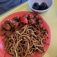 Fried noodles orange chicken and sweet soy sauce meat balls   at Oscar in Tokyo