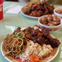 Deluxe plate with half fried rice, half noodles, sweet & sour pork, kung pao chicken and lemon chicken.  at Oscar in Tokyo