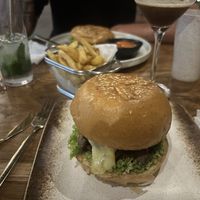 Cheese burger in the front and a slightly squashed in preparation to eat ultimate vegan burger in the back!   at Mana Retreat in 