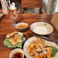 Garlic “butter” tofu, friend spring rolls, coconut coffee  at Thong Dong 2 - Vegan Friendly Kitchen in Lao Cai