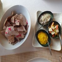 Rice and mushroom nachos with pickled vegetables, a bean dip and a butternut squash dip at Kina Kind Cuisine in Pattaya