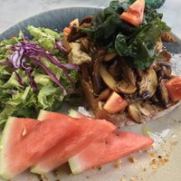 Breakfast: thick cut toast with hummus and sautéed mushrooms, served with a side salad  at Ver De in El Nido