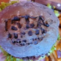 Vegan burger on charcoal bun at Isla Burger in Isla Mujeres