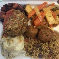 DELICIOUS lentil loaf on top, roasted beets and carrots, tofu and veggies in an amazing ginger sauce, meatballs (my absolute fave) and rice and beans   at Ma's Vegi Deli in St Thomas