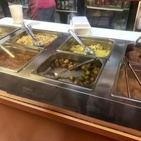 Such a great variety😄on the left it’s a no meat turkey, and they have tofu (3rd from the left on top) below that is potatoes. we tried all these and were yummy 😋  at Ma's Vegi Deli in St Thomas