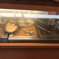 The sides: again great variety: the potato mash looking thing in an oval dish is mashed green papaya!!! Wow! Amazing!! at Ma's Vegi Deli in St Thomas