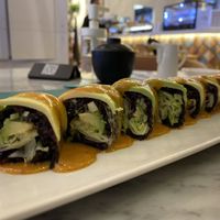 Riceberry Roll : Black rice, Avocado, Nut Sauce    at Sushi Library in Riyadh