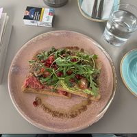 two toasts with beetroot/avocado spread + mushrooms, pomegranate seeds and rocket  at To Kafe Tis Chrysanthi's in Larnaca