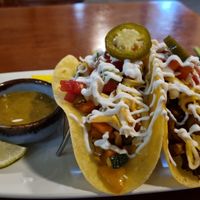 Sort tacos with vegan cheese and tofu chorizo. at La Casita in Chiang Mai