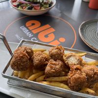 Vegan mushroom croquettes, fries and avocado salad.   at Albi in Malaga