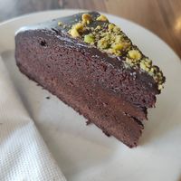 Vegan mudcake with crushed pistachios at Hides Bakery in Benalla