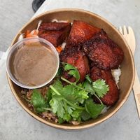 Vegan sticky rice with roast pork and mushroom sauce  at Little Phat Rolls in Braddon