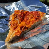 Pizza with vegan cheese and sausage! at Vegan Vibes in St Georges