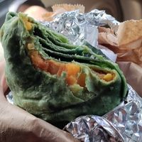 Spirulina roti filled with potatoes and split pea curry at Vegan Vibes in St Georges