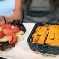 Vegan lasagna with vegan cheese on top at Serenity in Mindo