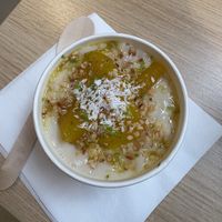 Poached pear, coconut + lime rice pudding  at Salt N Fire in Inverness