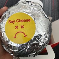 Burger with wrapper at Mr.Charlie's - San Francisco in San Francisco