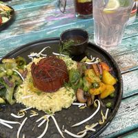 "Tender Plant-Based" Steak with risotto, vegetables & port vine sauce (23,90 €) - rhubarb lemonade (4,20 €)  at The Keep Garden Kitchen in Salzburg
