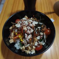 Vegan poke bowl (tofu, rice, carrots, jalapenos, corn, nori, almonds etc. with teriyaki and sriracha) at Luna's Bowls in Liberia
