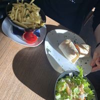 Seitan wrap and chips   at Cafe Erde in Graz