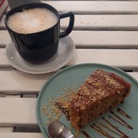 coffee with oat milk and carrot cake at La Oveja Negra in Madrid