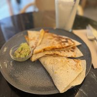 Quesadillas filled with seitan and served with an avocado dip  at La Oveja Negra in Madrid