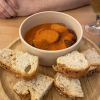 Chorizo in cider saucee  at La Oveja Negra in Madrid