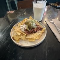 nachos and lemonade with coconut milk  at La Oveja Negra in Madrid
