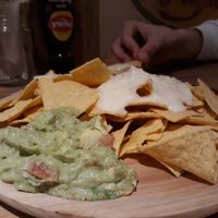 Nachos with vegan cheese, guacamole and chilli. at La Oveja Negra in Madrid