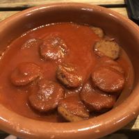 Chorizos en sidra, muy ricos  at La Oveja Negra in Madrid