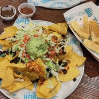 Nachos with vegan chorizos + yucca fries at Sabor Latin Street Grill in Durham