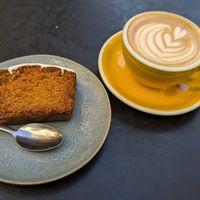 Oat milk latte and vegan carrot cake. at La Wilderie in Lille
