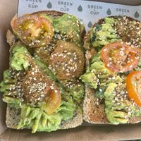 Avocado toast with tomato and dukah   at Green Cup in Carlton
