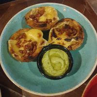 Plant-based Cheese & Bacon loaded potato skins: Meatless Farm plant-based bacon pieces, Applewood vegan cheese, avocado & lime dressing and sliced spring onions at TGI Fridays in Bolton