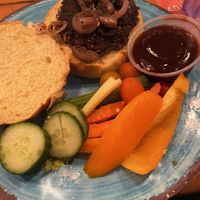 Red rice & hemp burger with caramelized onions and vegan bbq sauce. Raw vegetables rather than fries.  at The Rabbit Hole in Harpers Ferry