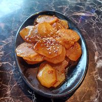 Spicy potato medallions at Dan Dan Noodle in Vancouver