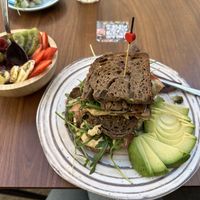 Açai bowl and vegan sandwich with added sautéed mushrooms   at La Mala Brunch - Setas in Sevilla
