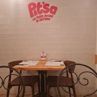 Inside tables at Pit'sa in Bergamo