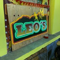 Leo's logo on the restaurant interior at Leo's Tacos Grill in Hidalgo