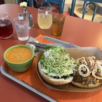 Seed & bean burger with a cup of Indian Coconut Tomato Soup. And 2 botanical tonics    at Our Food Is Art Restaurant and Bar in Crestone