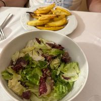 Side salad, rosemary potatoes at La Trattoria del Leone' di Lucarini Mauro in Urbino