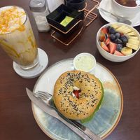 Bagel, caramel coffee and fruit bowl at Coconela in Santa Cruz