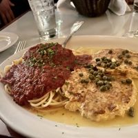 Vegan chicken piccata with spaghetti marinara  at Chase Restaurant and Lounge - temporarily closed in Santa Barbara