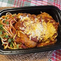 breaded vegan chicken parmigana topped with marinara sauce and vegan cheese, served with spaghetti marinara  at Chase Restaurant and Lounge - temporarily closed in Santa Barbara