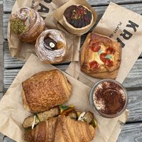 Pistachio cruffin, Chocolate hazelnut cruffin, Chocolate tart, Cashew mozzarella danish, Pain au chocolate, Tiramisu, Tempeh croissant   at Krafin in Prague