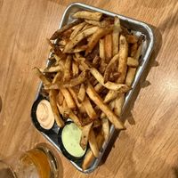 More fries and vegan sauces! at The Tiny Pony Tavern in Yucca Valley