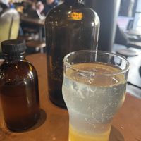 Mix yourself lemon sparkling soda- homemade lemon syrup and bottle of sparkling water  at Truth Coffee Roasting in Cape Town
