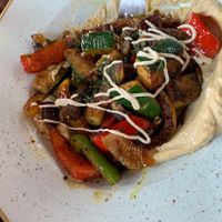 Grilled veggies on hummus, served with warm pita bread  at Orient Occident in Vienna